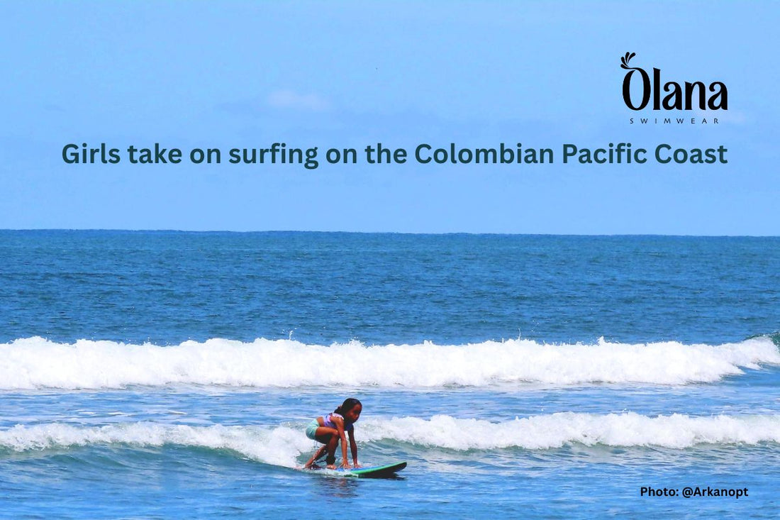 A girl stands up on a surfboard